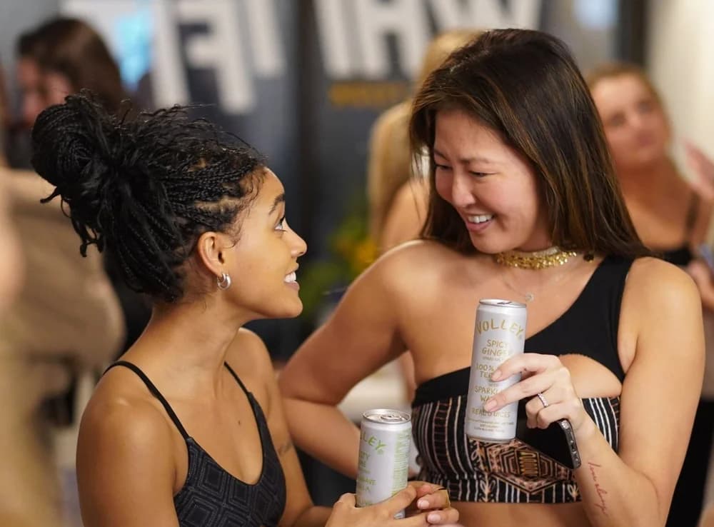 Guests laughing together at a brand activation event