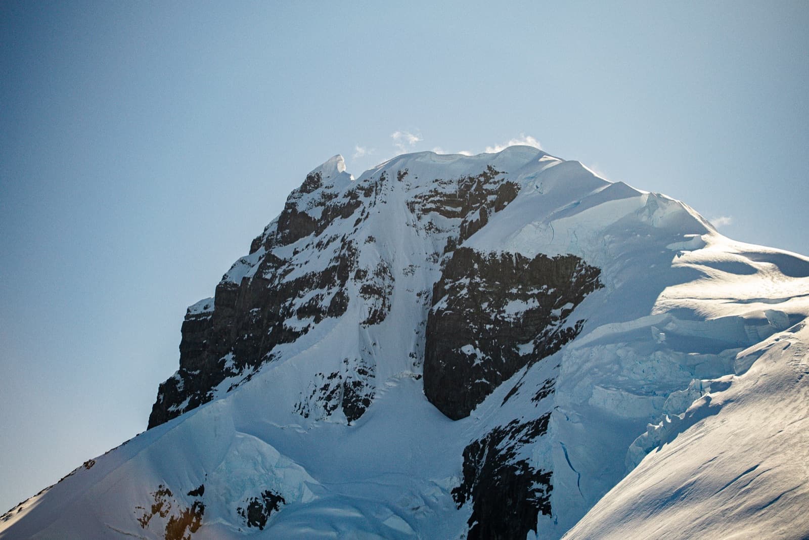 Snow-covered peaks along the Antarctic coastline